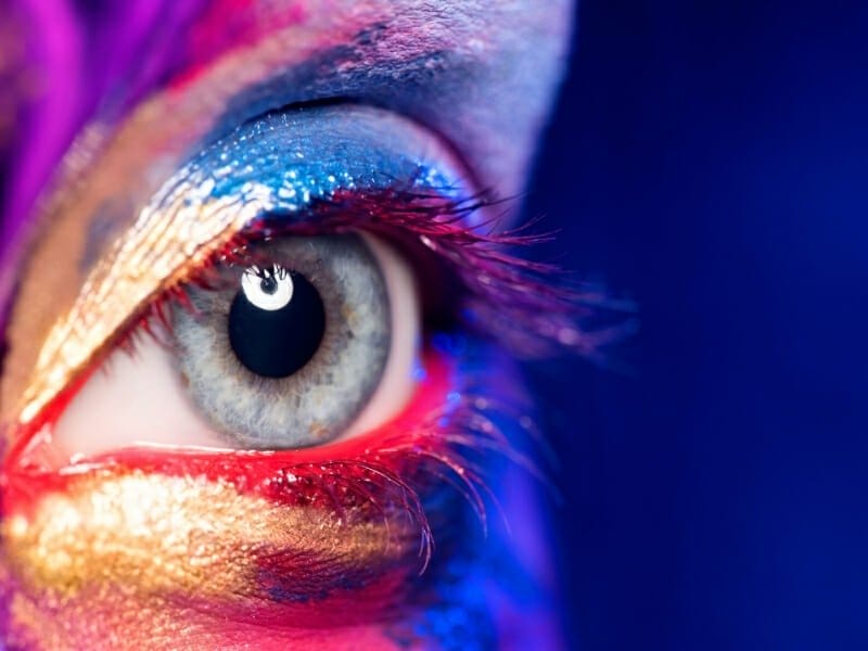 picture of eye and face paint to demonstrate web design creativity